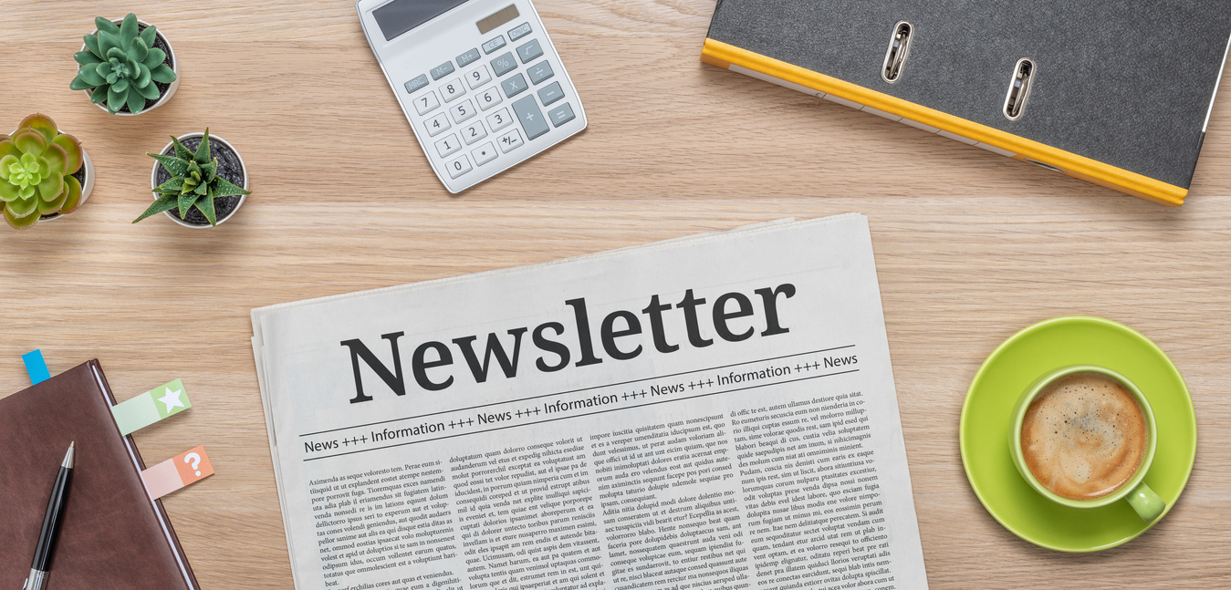 A newspaper on a desk with the headline Newsletter